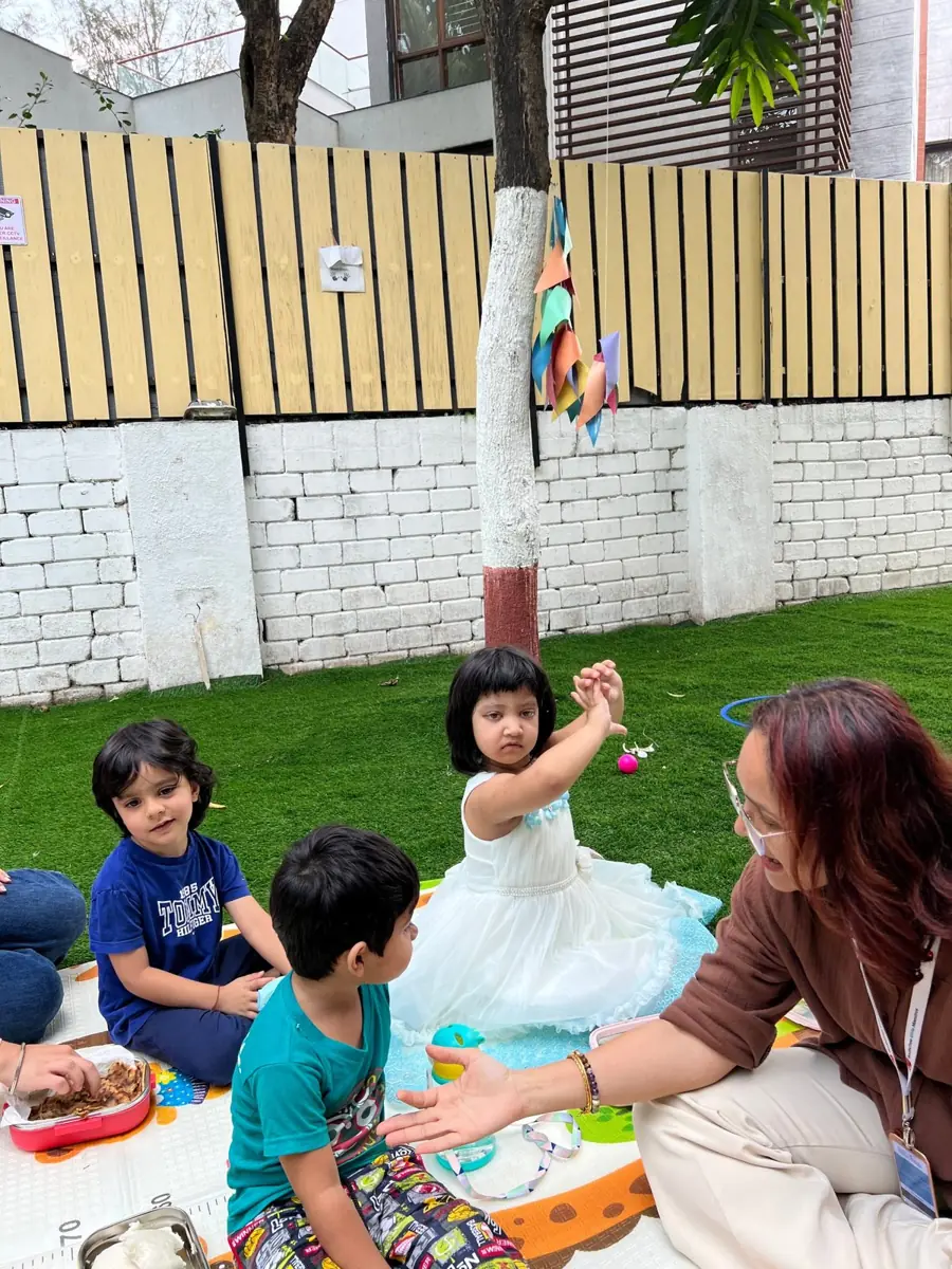 Children at circle time in the garden