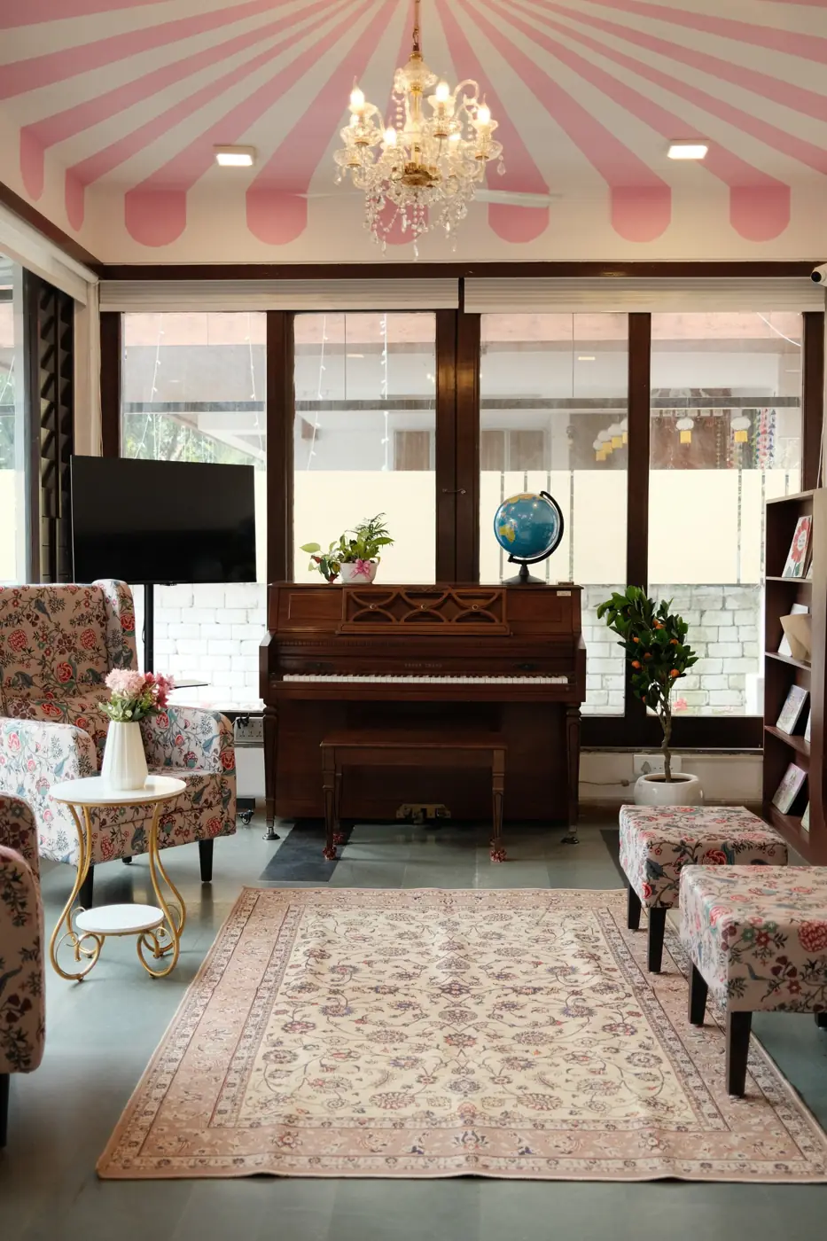 The piano lounge with its pink striped ceiling and chandelier
